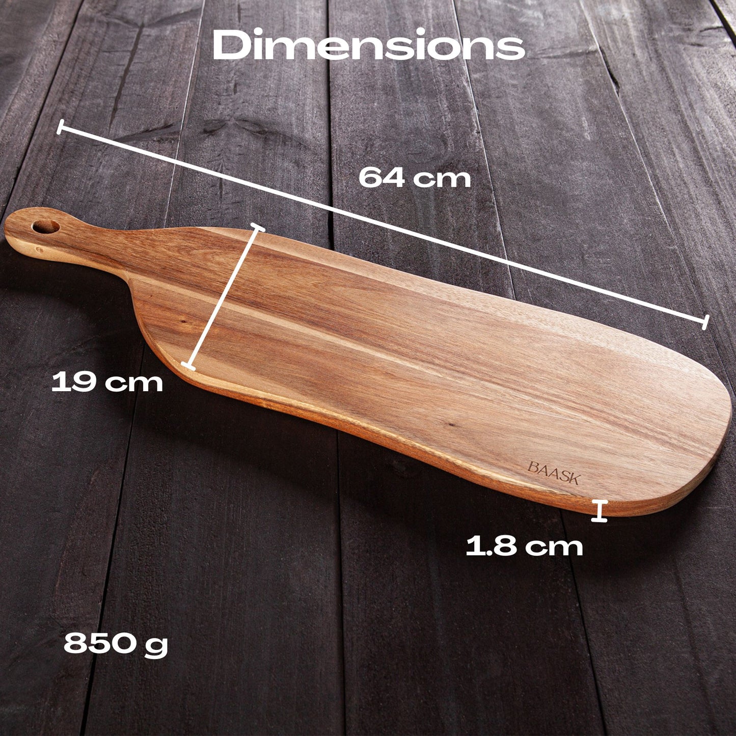 Long wooden paddle cheese board on dark wooden bench Showing dimensions