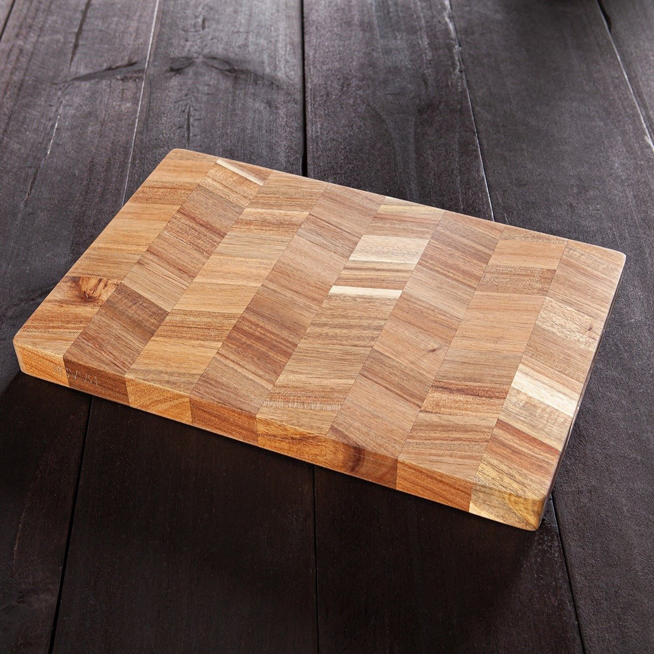 Acacia wood chopping board. Detailed chevron pattern. Built in grove handles